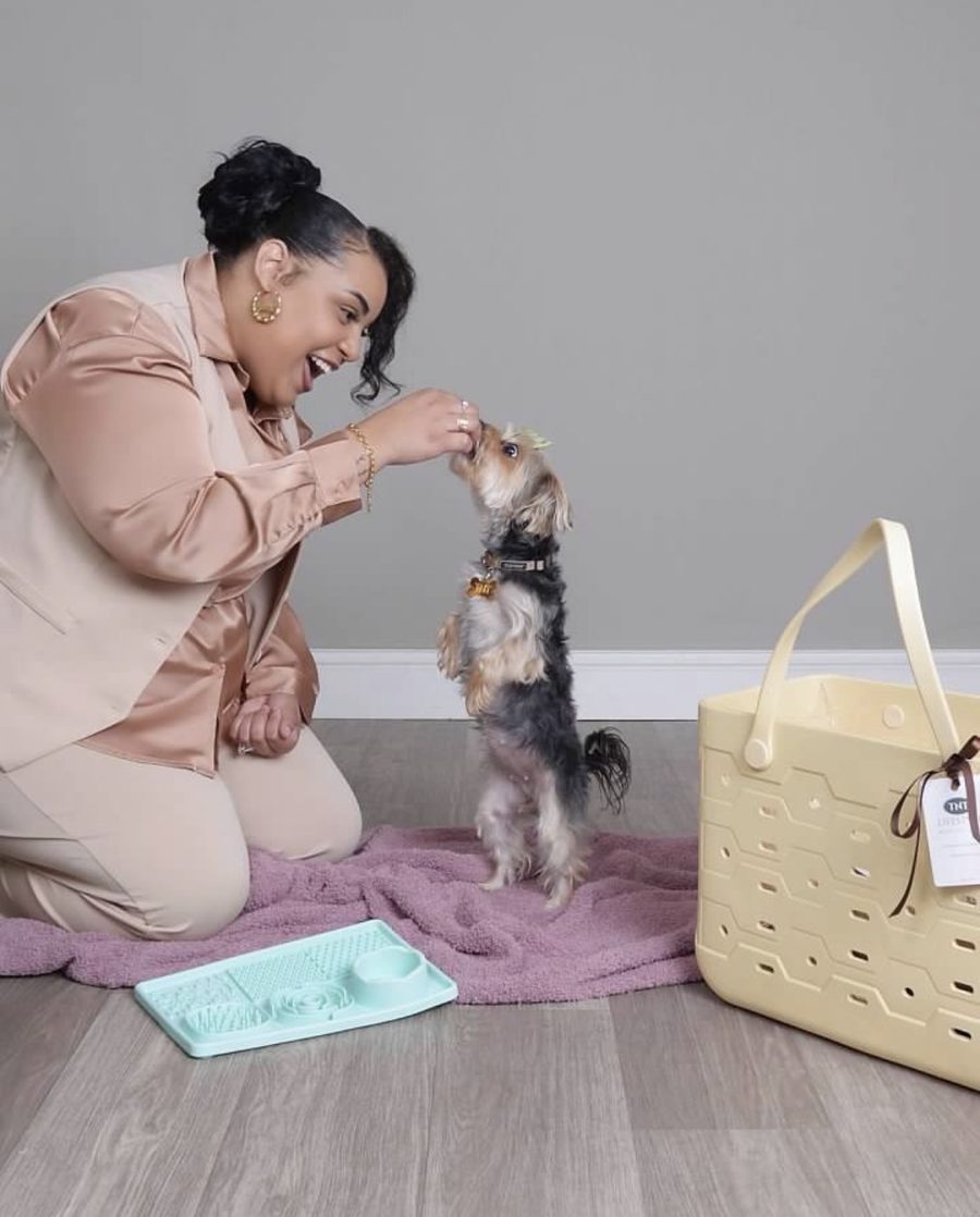 Tyona, founder of TNT Lifestyle, at home with Lulu and TNT Lifestyle products